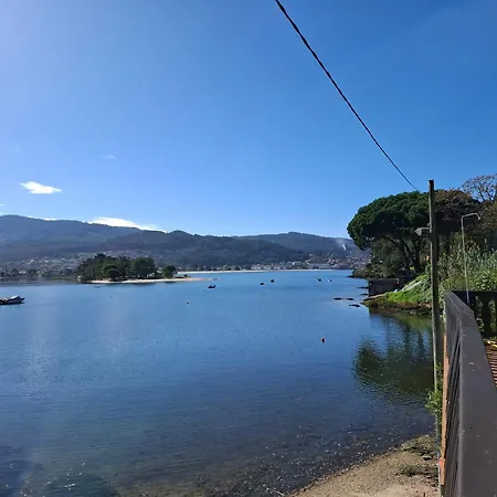 Casa De Madera Sobre El Mar Casa de Férias